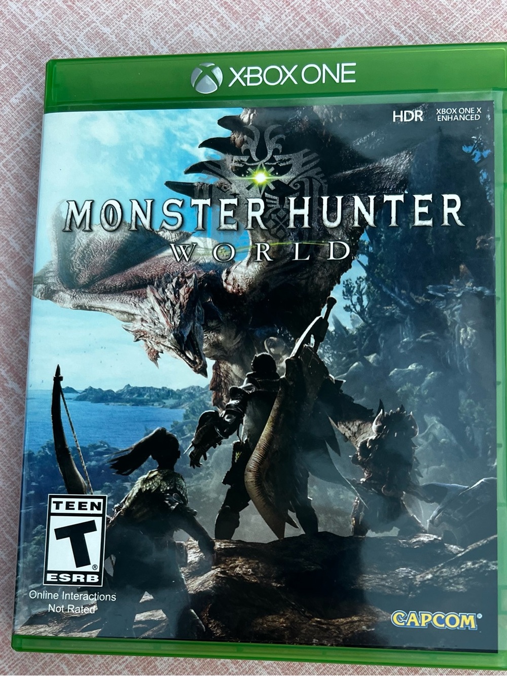 Microsoft Xbox One Monster Hunter: World Game with Green Case.